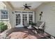 Outdoor patio featuring comfortable seating, a ceiling fan, and charming decor at 316 5Th N Ave, Safety Harbor, FL 34695