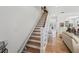 View of home staircase with chairlift and hardwood floors at 316 5Th N Ave, Safety Harbor, FL 34695
