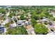 Aerial shot displaying a neighborhood street featuring homes with trees and updated solar panels at 3251 34Th S Ave, St Petersburg, FL 33713