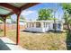 Backyard with lush green grass and patio area, ideal for outdoor enjoyment at 3251 34Th N Ave, St Petersburg, FL 33713