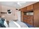 Traditional bedroom featuring built-in cabinets with a full bed at 3251 34Th N Ave, St Petersburg, FL 33713