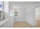 Bright bedroom featuring wood floors and a view of the neighborhood through a window at 3251 34Th N Ave, St Petersburg, FL 33713