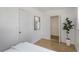 Neat bedroom featuring clean white walls, hardwood floors, and a modern art piece at 3251 34Th N Ave, St Petersburg, FL 33713