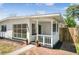 Charming single-story home featuring a welcoming porch and a well maintained front yard with a brick walkway at 3251 34Th N Ave, St Petersburg, FL 33713