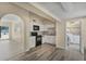 Cozy kitchen with white cabinets and stainless steel appliances conveniently located next to the laundry room at 3251 34Th S Ave, St Petersburg, FL 33713
