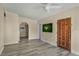 Neutral living area showcasing wood-look floors, archway access, and simple decor at 3251 34Th N Ave, St Petersburg, FL 33713