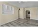 Open living space with wood-style floors and a built-in shelf, perfect for modern living at 3251 34Th N Ave, St Petersburg, FL 33713