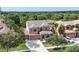 Aerial view of a grand two-story home showcasing its manicured landscaping and three-car garage at 32718 Summerglade Dr, Wesley Chapel, FL 33545
