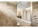 Walk in shower featuring tiled walls, a built in soap dish and clear glass shower enclosure at 32718 Summerglade Dr, Wesley Chapel, FL 33545