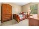 Cozy bedroom with a comfortable bed, dresser, and natural light from the window, perfect for relaxing at 32718 Summerglade Dr, Wesley Chapel, FL 33545