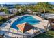 A refreshing community pool with lounge chairs and shade structures for relaxation at 32718 Summerglade Dr, Wesley Chapel, FL 33545