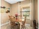 Cozy dining area with a small table and chairs, perfect for casual meals and conversation at 32718 Summerglade Dr, Wesley Chapel, FL 33545