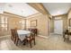Elegant dining area with tile flooring and traditional decor, showcasing a comfortable and inviting space at 32718 Summerglade Dr, Wesley Chapel, FL 33545