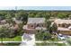 Beautiful aerial view showcases a well-maintained house, green lawns, mature trees, and neighborhood at 32718 Summerglade Dr, Wesley Chapel, FL 33545