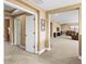 Upstairs hallway featuring neutral walls with view into the living room at 32718 Summerglade Dr, Wesley Chapel, FL 33545