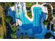 Aerial view of a resort-style pool with lush landscaping and inviting lounging areas at 32718 Summerglade Dr, Wesley Chapel, FL 33545