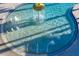 Close-up of a splash pool featuring a waterfall feature and shallow water at 32718 Summerglade Dr, Wesley Chapel, FL 33545
