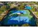 Aerial view of community tennis courts surrounded by lush landscaping at 32718 Summerglade Dr, Wesley Chapel, FL 33545