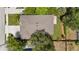 This is an aerial view of the home showcasing its roof and driveway at 3605 W Paxton Ave, Tampa, FL 33611