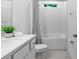Bright bathroom featuring a shower/tub combo with white subway tiles and a granite vanity at 3605 W Paxton Ave, Tampa, FL 33611
