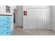 Bright bedroom featuring light blue walls, a pastel dresser, and a neutral-colored carpet at 3605 W Paxton Ave, Tampa, FL 33611