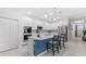 Spacious kitchen featuring stainless steel appliances, a marble island, and stylish pendant lighting at 3605 W Paxton Ave, Tampa, FL 33611