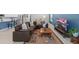Living room with brown sectional, tile flooring, and a colorful rug at 3605 W Paxton Ave, Tampa, FL 33611
