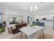 Open floor plan with living room, kitchen, and dining area offers lots of room for entertaining at 3605 W Paxton Ave, Tampa, FL 33611
