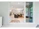Open living room features neutral colors and a sliding glass door to the outside patio at 3605 W Paxton Ave, Tampa, FL 33611