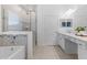 Main bathroom features a walk-in shower and a separate tub at 3605 W Paxton Ave, Tampa, FL 33611