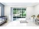 The patio has a covered seating area with a hammock and lush landscaping at 3605 W Paxton Ave, Tampa, FL 33611