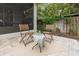 Relax on the brick patio with comfortable seating, perfect for enjoying the serene backyard at 3605 W Paxton Ave, Tampa, FL 33611