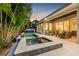 A spacious backyard features a pristine pool and spa, complemented by a covered patio for elegant outdoor living at 3711 W Barcelona St, Tampa, FL 33629