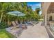 A beautiful backyard featuring lounge chairs with a view of a tropical pool at 3711 W Barcelona St, Tampa, FL 33629