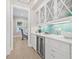 Bright bar area with beverage center, glass cabinets, and stylish backsplash at 3711 W Barcelona St, Tampa, FL 33629