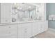 Luxurious bathroom with double vanity sinks, modern lighting, and stylish decor at 3711 W Barcelona St, Tampa, FL 33629