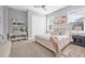 Comfortable bedroom features a bed, a desk, a ceiling fan and natural light from the window at 3711 W Barcelona St, Tampa, FL 33629
