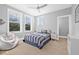 Cozy bedroom with large windows, modern decor, and a comfortable bed, offering a serene retreat at 3711 W Barcelona St, Tampa, FL 33629