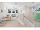 Bonus room with hardwood floors leading into the carpeted sitting area and stairs at 3711 W Barcelona St, Tampa, FL 33629