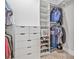 Walk-in closet featuring custom shelving, drawers, and ample storage space at 3711 W Barcelona St, Tampa, FL 33629