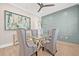 Dining room featuring a modern table, decorative wall paneling and elegant furnishings at 3711 W Barcelona St, Tampa, FL 33629
