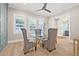 Dining room with windows, modern light fixture and glass table at 3711 W Barcelona St, Tampa, FL 33629