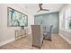 The dining room showcases a modern table, light wood floors, and designer wall paint at 3711 W Barcelona St, Tampa, FL 33629