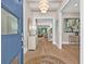 Welcoming foyer with hardwood floors, elegant lighting, and an open view into the living spaces at 3711 W Barcelona St, Tampa, FL 33629