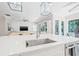 Bright kitchen, showcasing a central island with modern fixtures and a seamless transition to living spaces at 3711 W Barcelona St, Tampa, FL 33629