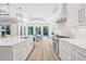 Bright kitchen with a large island, modern appliances, and adjacent dining area at 3711 W Barcelona St, Tampa, FL 33629