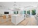 Spacious kitchen with a large island, seamlessly connecting to the living and dining areas at 3711 W Barcelona St, Tampa, FL 33629