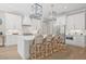 Modern kitchen with white cabinets, stainless steel appliances, quartz counters, and tiled backsplash at 3711 W Barcelona St, Tampa, FL 33629