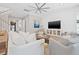 Bright living room with white shiplap accent wall, comfortable seating, and modern decor at 3711 W Barcelona St, Tampa, FL 33629