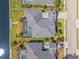Aerial shot of the property highlighting the pool, landscaping, and canal access at 4612 Barracuda Dr, Bradenton, FL 34208